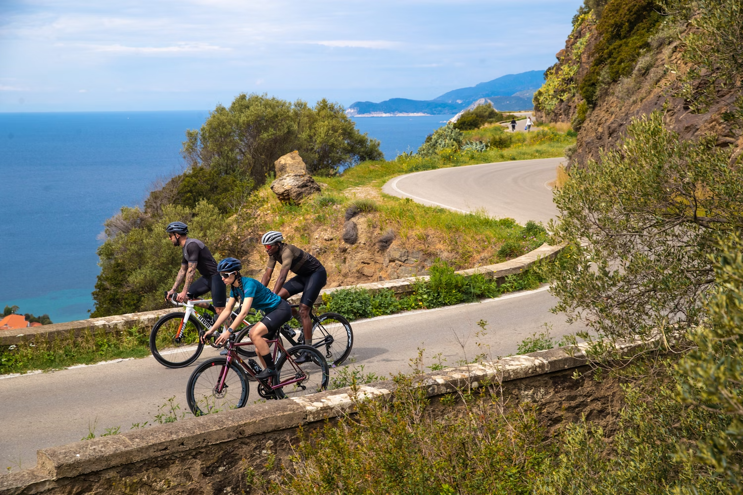 Cyclists riding on scenic coastal road